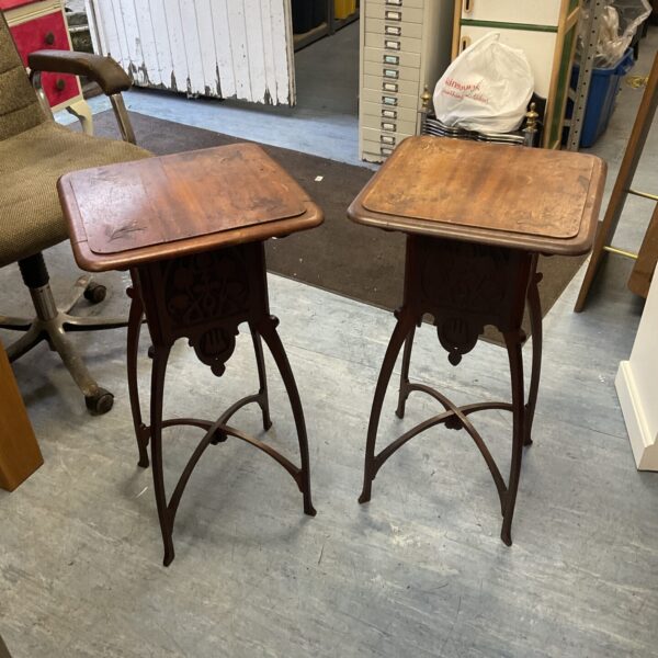 Pair of antique Art Nouveau side tables with carved details.