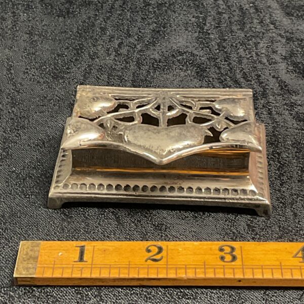 Vintage Art Nouveau whitemetal stamp box with floral design.