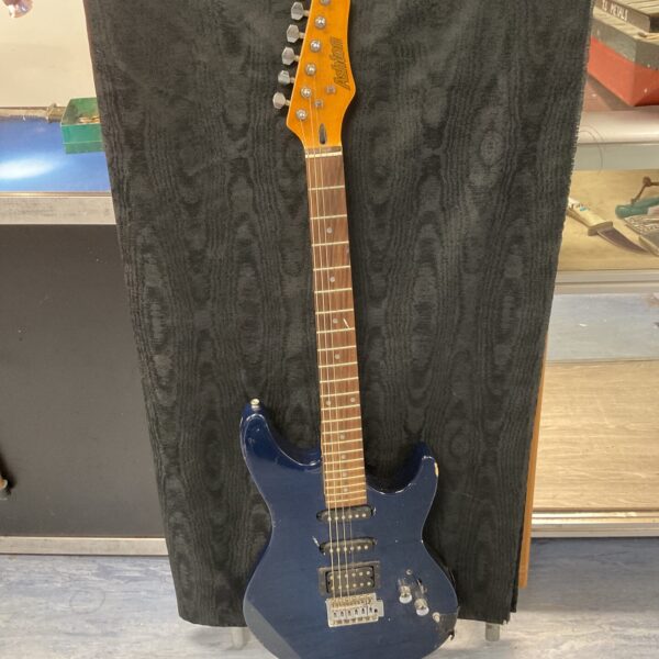 Blue Ashton electric guitar with a single humbucker pickup.