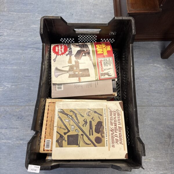 Vintage book lot with military and woodworking magazines.