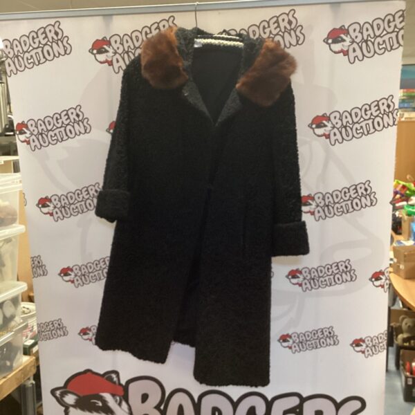Dark Astra Furs ladies coat with fur collar.