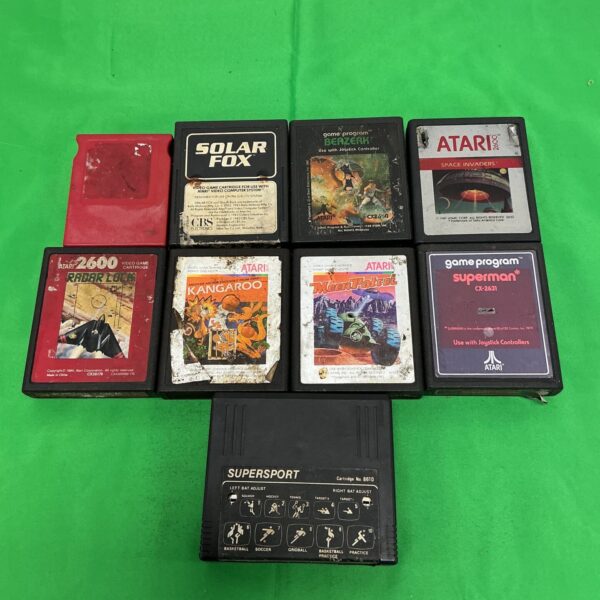 Vintage Atari 2600 game cartridges in a lot for retro gaming.