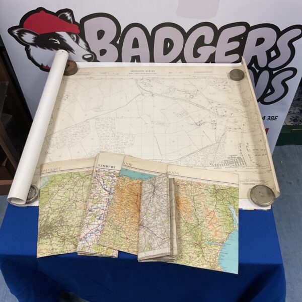 Vintage Ordnance Survey maps displayed on a table at Badger's Auctions.