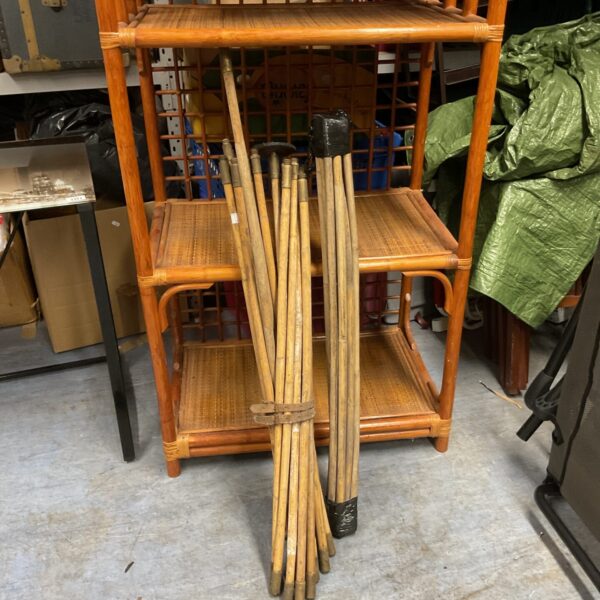 Set of vintage bamboo drain rods for plumbing and drain cleaning.