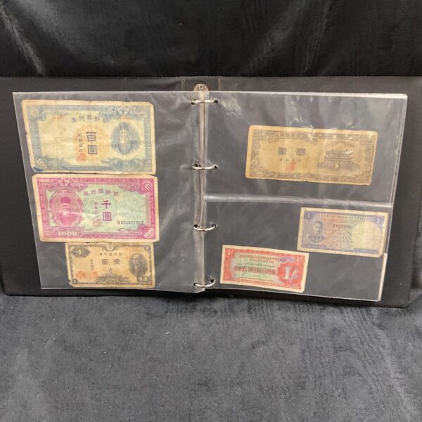Front view of a banknote collection in a ring binder.