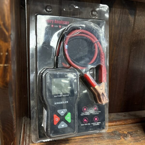 Close-up of BM550 battery analyser with display and testing leads.
