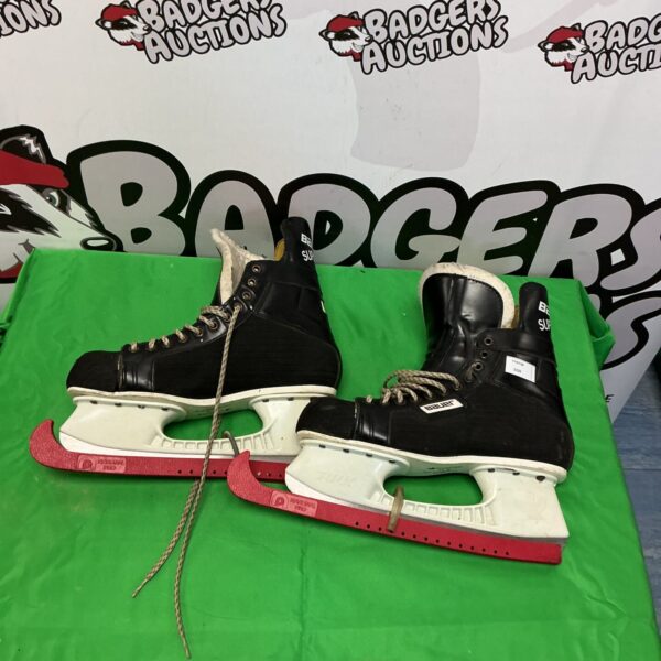 Bauer Supreme size 11 ice skates showing wear and tear.