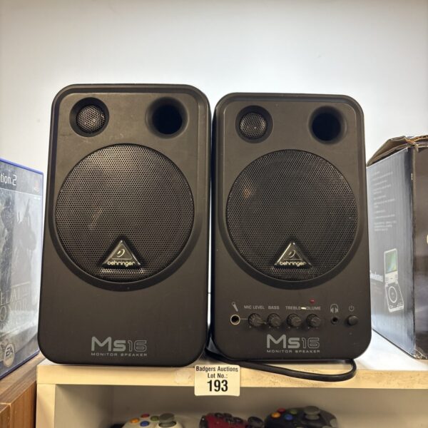 Pair of Behringer Ms16 monitor speakers for studio audio.