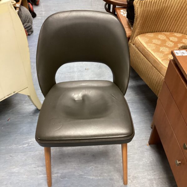 Vintage Ben Stoe chair with wooden legs and molded seat.