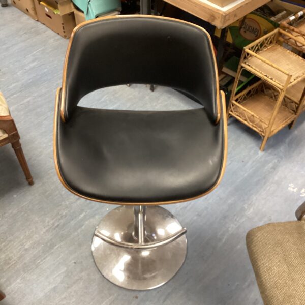 Black bentwood barstool with swivel base, vintage style.
