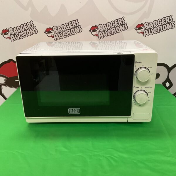 Front view of a vintage Black and Decker microwave oven.