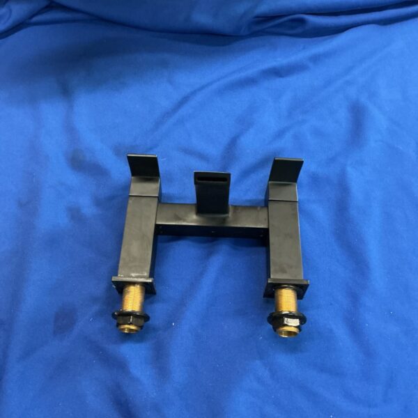 Front view of matt black bath mixer tap on blue fabric.