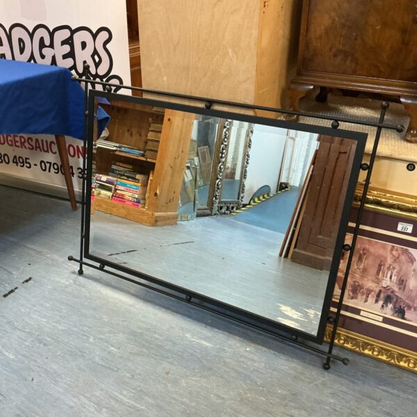 Black metal framed mirror for modern home decor.