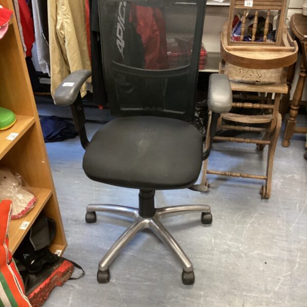 Black office chair with mesh back and adjustable height.