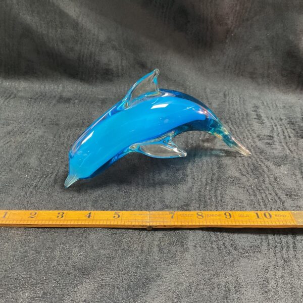 Vibrant blue studio art glass dolphin sculpture.