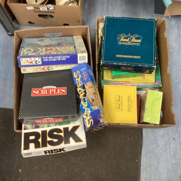 Vintage board game lot featuring Risk and Trivia Pursuit.