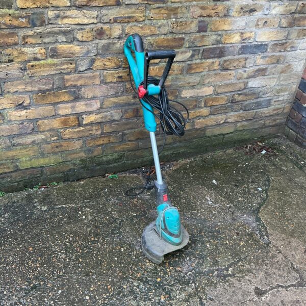 Bosch electric garden strimmer for lawn and garden maintenance.