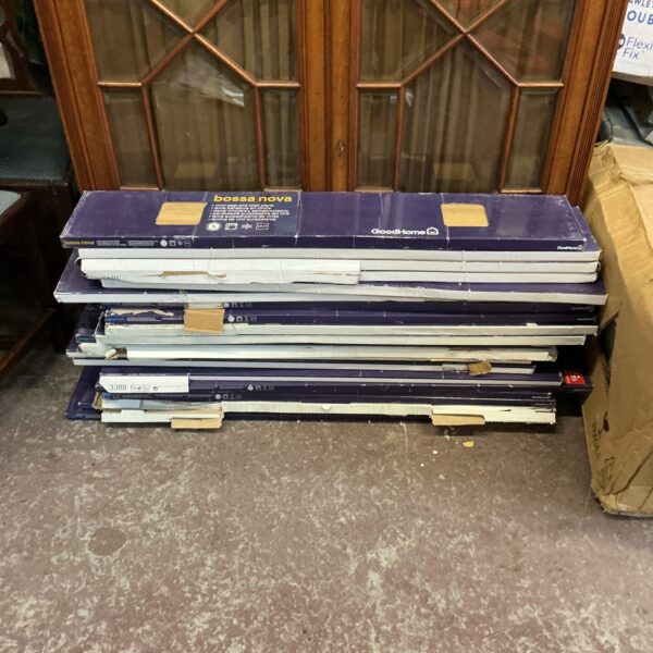 Stack of Bossa Nova vinyl flooring planks for home renovation.