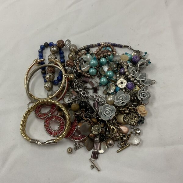 Diverse bracelet lot with beaded and charm styles.