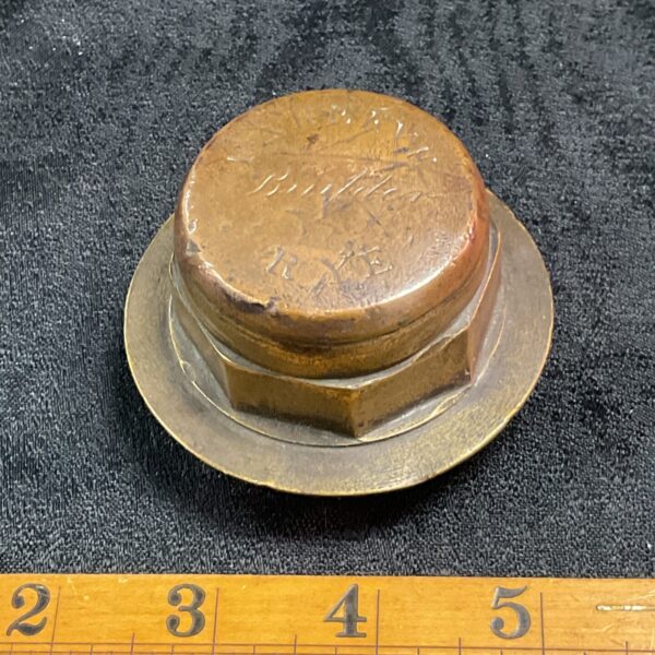 Antique brass cart hub cap marked "Rye" for collectors.