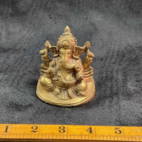 Detailed brass Ganesha statue, a Hindu deity sculpture for home decor.