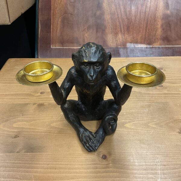 Vintage brass monkey tea light holder with candle platform.