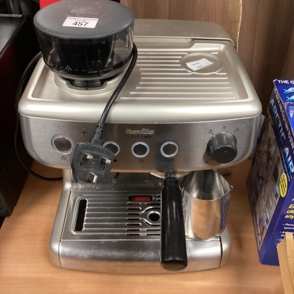 Front view of a stainless steel Breville barista coffee machine.