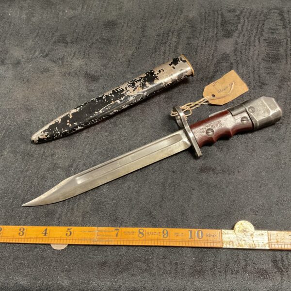 Vintage British No7 bayonet with wooden grip and steel scabbard.