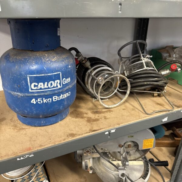 Calor Gas butane canister with two gas lanterns for outdoor use.
