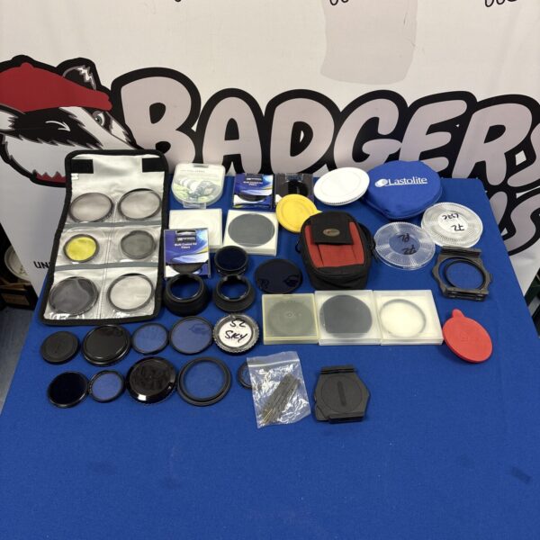 Collection of vintage camera lens filters and accessories.