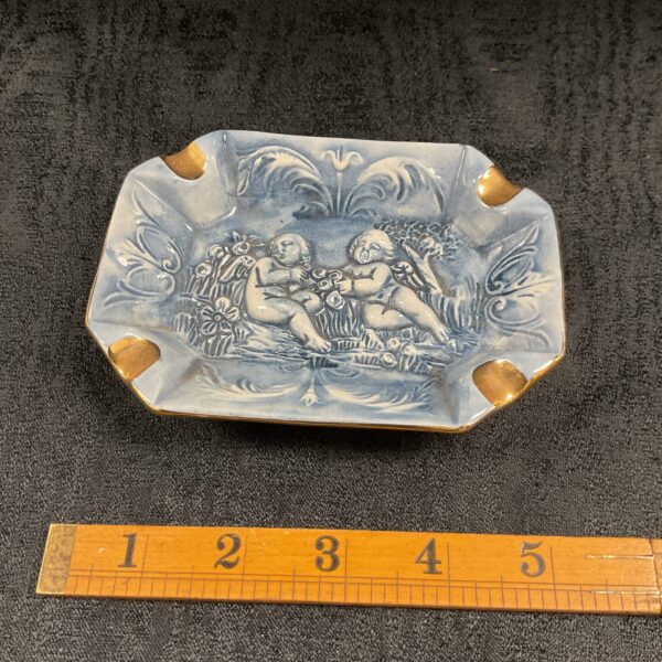 Vintage Capo DeMonte porcelain ashtray with cherub figural design.