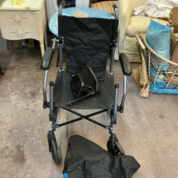 Used Care Co foldable wheelchair for mobility assistance.