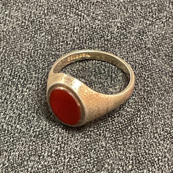 Vintage carnelian stone ring with gold on silver band.