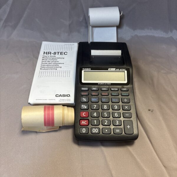 Vintage Casio HR-8TEC mini printing calculator with instruction manual.