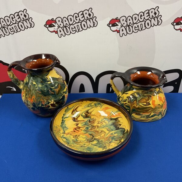 Vibrant Catalan terracotta jug and bowl set, hand-painted Spanish pottery.