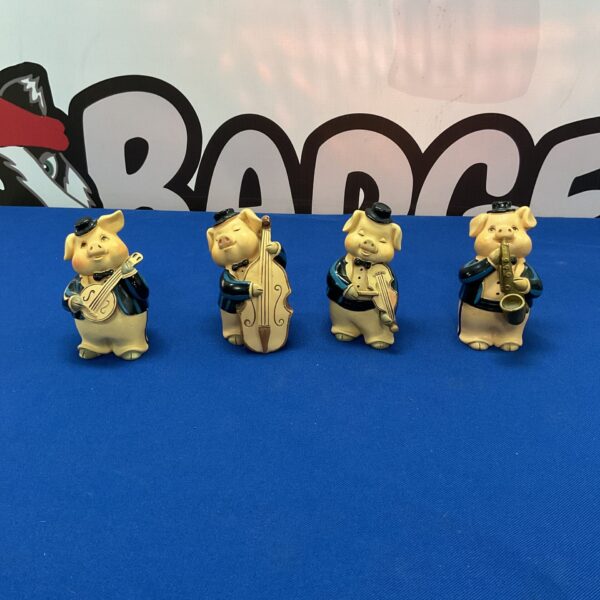 Full group of vintage ceramic pig band musicians.