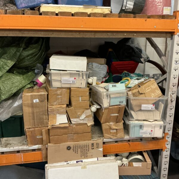 Quantity of white ceramic wall tiles in a storage lot.