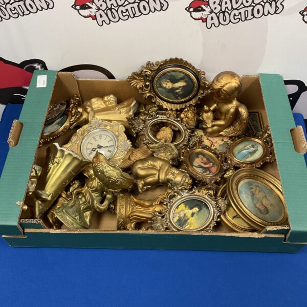 Gold tone cherub ornaments and vintage photo frames in a decorative lot.