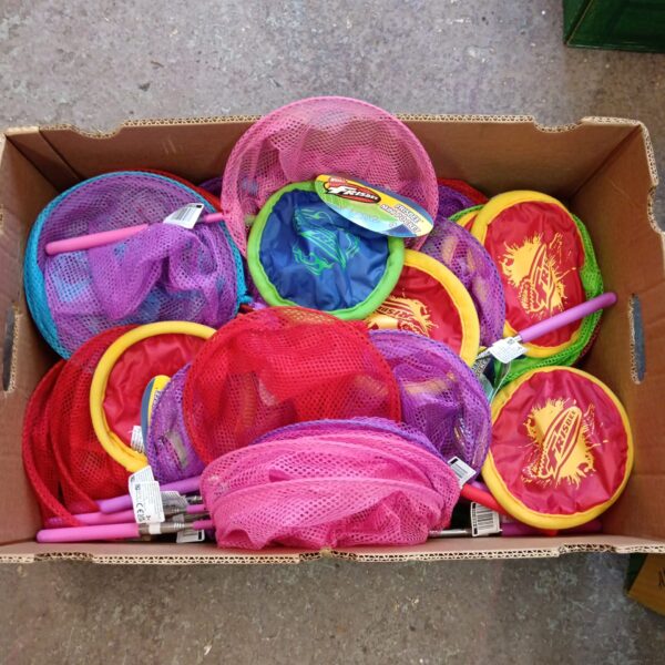 Brightly coloured children's fishing nets and frisbees in a box.