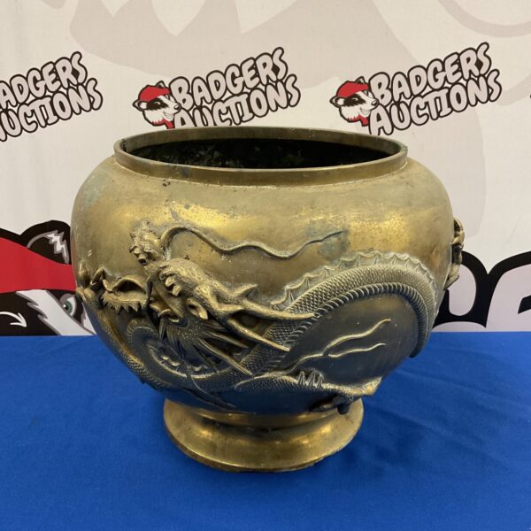Large antique Chinese brass dragon pot with intricate detailing.