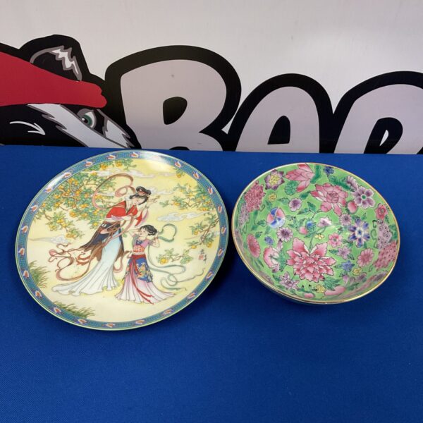 Antique Chinese Famile Rose plate and bowl set, vibrant floral design.