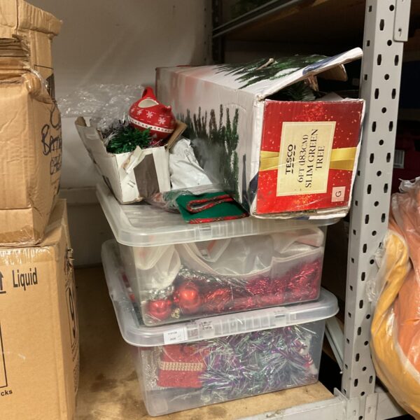 Large lot of Christmas decorations including a tree and ornaments.