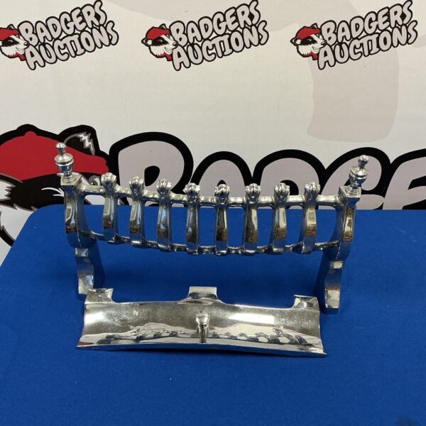 Vintage chrome fire front for open fireplace with decorative bars.