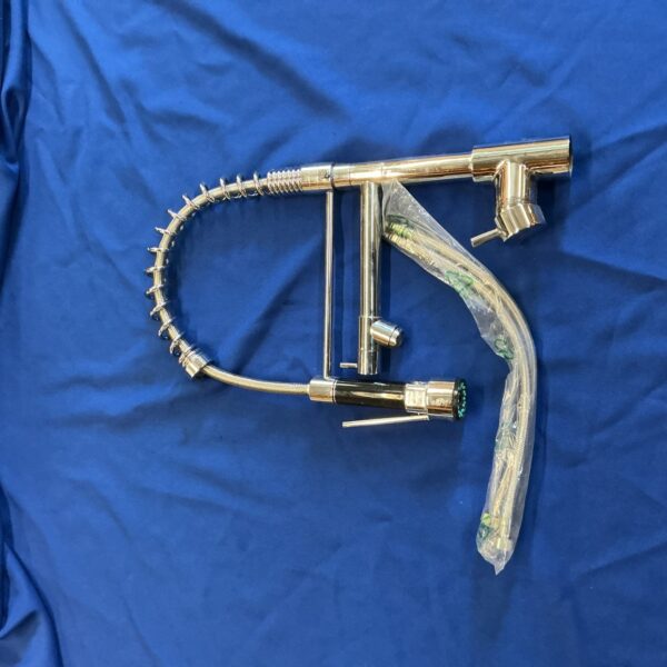 Chrome kitchen mixer tap with dual spout for sink use.