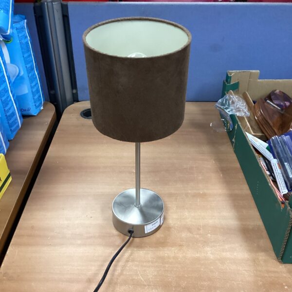 Vintage chrome table lamp with fabric shade for bedside or desk.