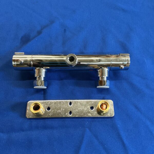 Chrome thermostatic shower mixer, wall mounted bathroom fixture.