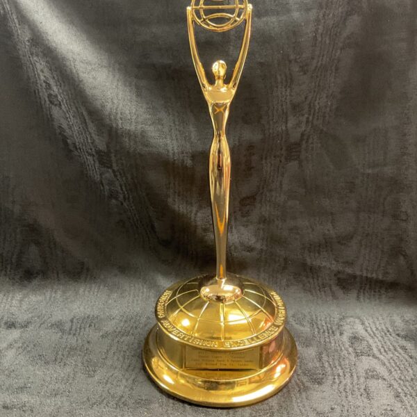 Gilded metal Clio Award trophy, front view.