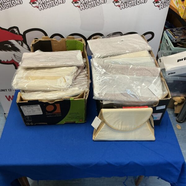 Assorted new clutch bags in a mixed lot, fashion accessories.
