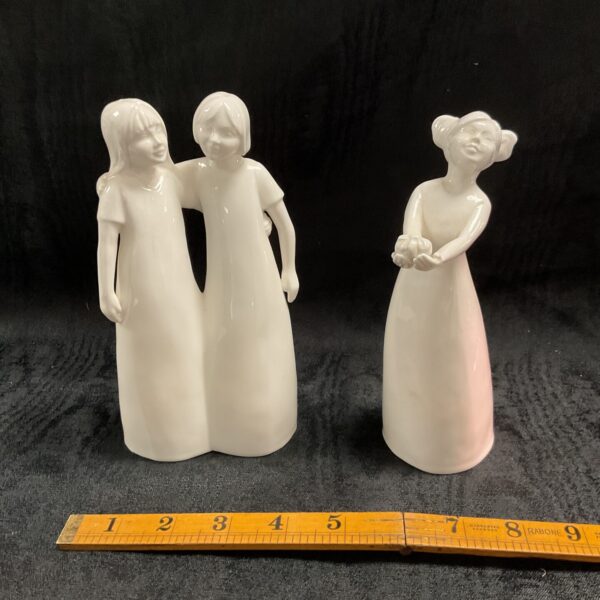 Elegant Coalport figurines from the "Moment" collection, a charming pair.