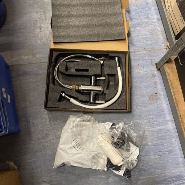 Chrome kitchen mixer tap with in-line water filters in original packaging.